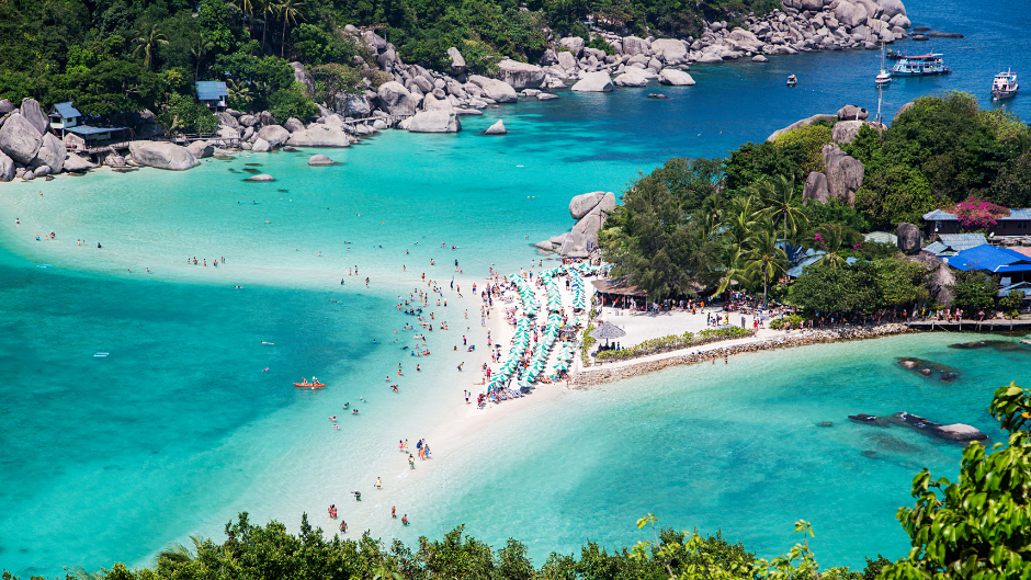 On a beach in northern Thailand, a beauty model is working on a new photo shoot.